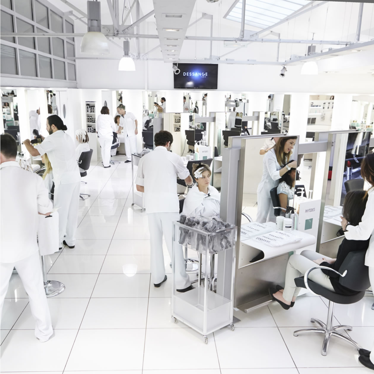 Bright Dessange salon interior with styling stations and mirrors